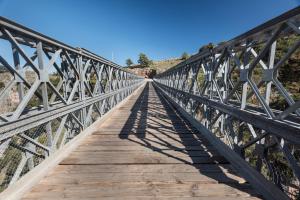 a bridge in the desert with a blue sky at ARADENA TRADITIONAL House 4 in Arádhaina