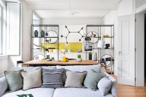 a living room with a couch and a table at GuestReady - Bliss Apartments in Lisbon