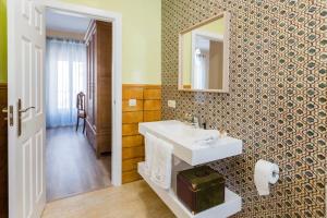 a bathroom with a sink and a mirror at CASA LOS LAGARES in Moriles +40 photos