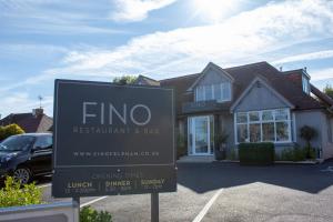 a sign in front of a house at Fino Rooms in Felpham