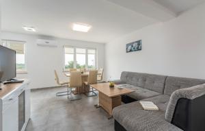 a living room with a couch and a table at Apartments Smilys in Novigrad Istria