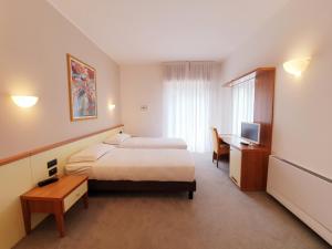 Posteľ alebo postele v izbe v ubytovaní Hotel Ristorante al Giardinetto + 31 fotografií