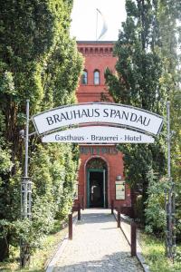 a sign for the entrance to a brick building at Brauhaus in Spandau in Berlin
