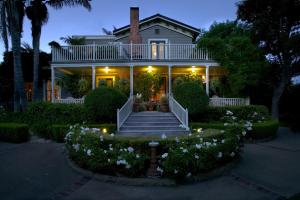 a house that has a garden with flowers in it at Simpson House Inn in Santa Barbara