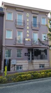 a pink building with a hotel sign on it at Ribad Hotel in Istanbul