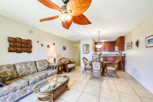 a living room with a couch and a table at Kamaole Sands in Wailea