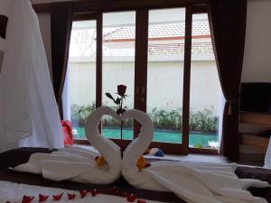 Ein Bett oder Betten in einem Zimmer der Unterkunft The Satya Villa
