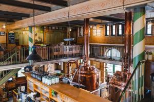 a large room with a brewery in a building at Brauhaus in Spandau in Berlin