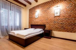 Ένα ή περισσότερα κρεβάτια σε δωμάτιο στο Apartamente Lux Unirii