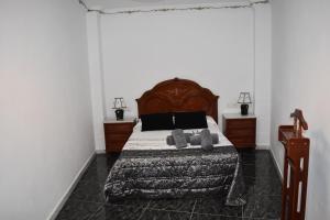 A bed or beds in a room at Alojamiento Rural Carmen