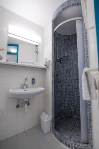 a bathroom with a shower and a sink at Schloss Puchberg in Wels