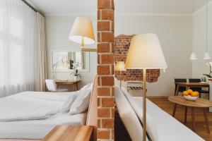 Postel nebo postele na pokoji v ubytování Apartamenty Bracka 6