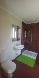 a bathroom with a toilet and a sink and a shower at Iacobus VUT-CO-00371O in Padrón