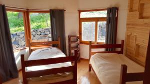 Postel nebo postele na pokoji v ubytování Las Palmas Lodge