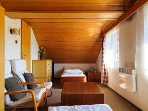 Postel nebo postele na pokoji v ubytování Holiday Villa Ruprechtice