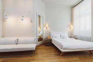 Postel nebo postele na pokoji v ubytování Apartamenty Bracka 6