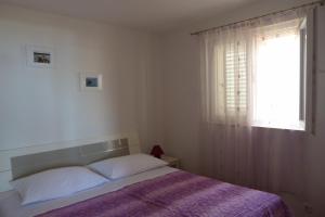 Postel nebo postele na pokoji v ubytování Apartments Čobanov