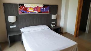 Postel nebo postele na pokoji v ubytování Alcocebre Suites Hotel
