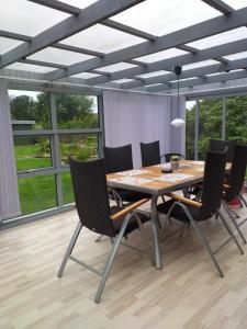 a dining room with a table and chairs at Villa in Brande in Gammel Blåhøj