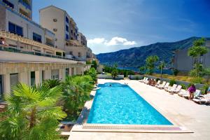 a swimming pool in the middle of a building at Apartment Dobrota View in Dobrota