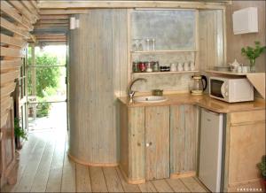 a kitchen with a sink and a microwave at Vitals On the Mountain in Katzir in Katzir 