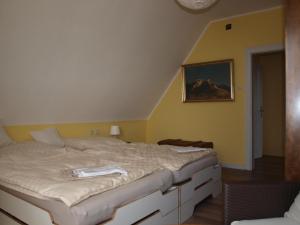 a bedroom with a large bed in a room at Ferienhaus Maria in Vinningen