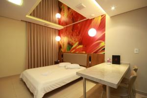 เตียงในห้องที่ Vitara Motel (Adult Only)