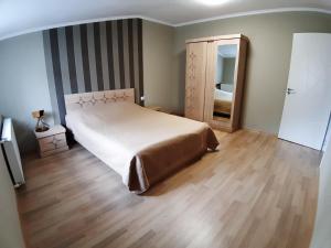 Postel nebo postele na pokoji v ubytování gogoli family hotel