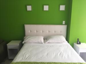 Postel nebo postele na pokoji v ubytování Hotel Garden City Boutique