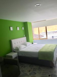 Postel nebo postele na pokoji v ubytování Hotel Garden City Boutique