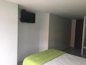Postel nebo postele na pokoji v ubytování Hotel Garden City Boutique