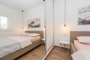 Posteľ alebo postele v izbe v ubytovaní Angela Luxury Apartment II