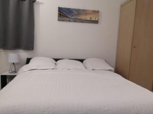 Cama ou camas em um quarto em Le Studio De Deauville Plage