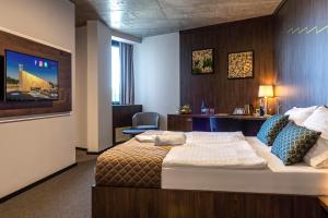 Postel nebo postele na pokoji v ubytování Hotel D1 + 34 fotografií