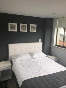Postel nebo postele na pokoji v ubytování Hotel Garden City Boutique