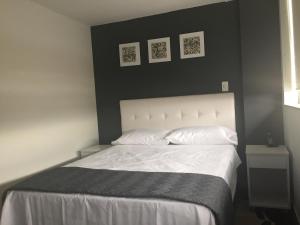 Postel nebo postele na pokoji v ubytování Hotel Garden City Boutique