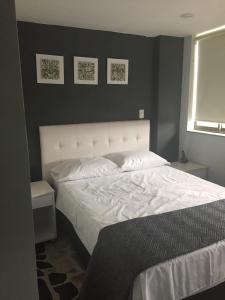 Postel nebo postele na pokoji v ubytování Hotel Garden City Boutique