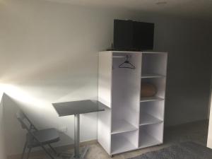 TV a/nebo společenská místnost v ubytování Hotel Garden City Boutique