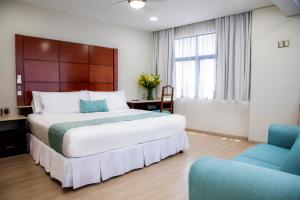 Voodi või voodid majutusasutuse Suites Coben Apartamentos Amueblados toas