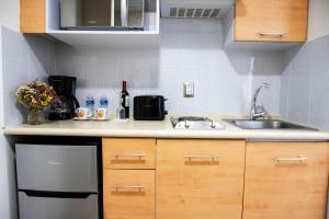 Köök või kööginurk majutusasutuses Suites Coben Apartamentos Amueblados