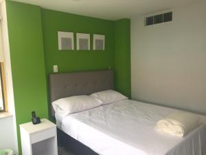 Postel nebo postele na pokoji v ubytování Hotel Garden City Boutique