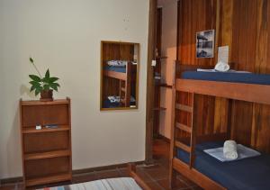 Cama ou camas em um quarto em Pousada Renascer