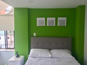 Postel nebo postele na pokoji v ubytování Hotel Garden City Boutique