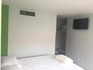 Postel nebo postele na pokoji v ubytování Hotel Garden City Boutique