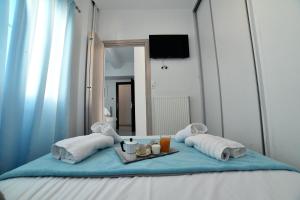 A bed or beds in a room at Central Athens Studios