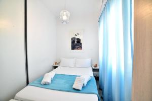 A bed or beds in a room at Central Athens Studios