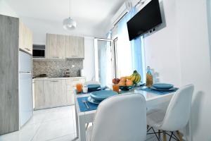 A kitchen or kitchenette at Central Athens Studios