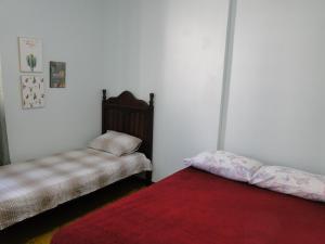 En eller flere senge i et værelse på Ed forte da Praia