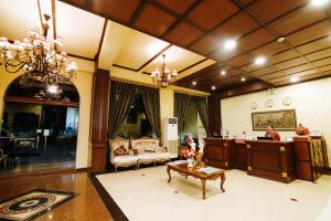 a living room with a couch and a table at Hotel San Marco in General Santos