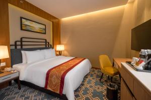 Postel nebo postele na pokoji v ubytování MPalace Hotel KL